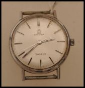 A mid 20th century Omega Geneve watch having a silvered dial with baton numerals.