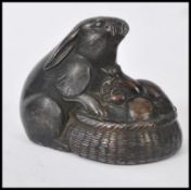 A 19th century Victorian cold painted bronze lead model figurine / paperweight of a hare peering