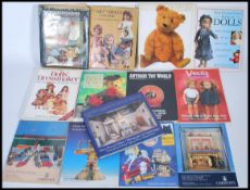 A selection of doll and toy related books to include 'The Art of Dolls 1700-1940' by Madeline