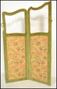 A vintage early 20th century two panel discretionary screen having inset bevelled glass panels