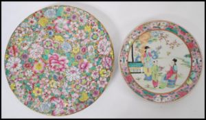 An early 20th century Chinese canton enamel plate having pink floral borders and central white