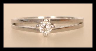 A 14ct white gold 585 stamped solitaire diamond ring having a central diamond in claw setting with