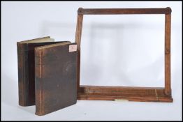 A vintage 20th Century concertina photograph album having a leatherette cover and gilt edges,