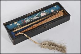 A fantastic 19th century Chinese ladies hand fan having silk panels with hand embroidered decoration