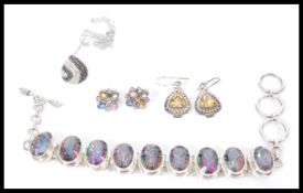 A selection of ladies contemporary jewellery to include a pair of silver drop earrings set with