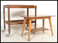 A retro Danish inspired mid century teak wood butlers serving trolley having twin tiers together
