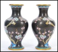 A 20th century pair of Chinese Cloisonne on brass baluster vases having decoration of flowers on