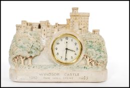 A vintage early 20th century chalk ware model of Windsor castle with inset barrel mantel clock.