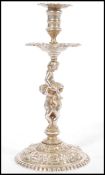 A 19th century Victorian hallmarked silver candlestick raised on circular base with figural cherub