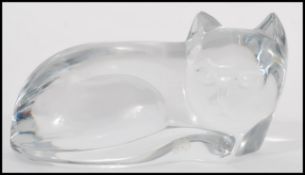 A vintage 20th century Val St Lambert clear glass figurine of a cat being signed by artist to