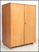 A 1970's Scandinavian retro teak wood office Industrial cube desk - filing cabinet having twin
