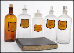 A selection of 19th Century Victorian apothecary / poison bottles having shaped yellow labels and