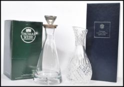 A boxed Thomas Webb clear glass decanter of tapering form having a silver hallmarked collar and