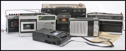 A collection of vintage transistor receiver radios to include examples by Sanyo,Grundig, Sony etc.