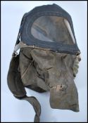 A WWII Second World War baby's / infants Civilian gas mask, made with khaki canvas and window to the