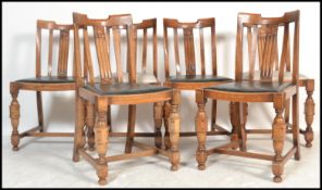 A set of 6  1930's Art Deco oak dining chairs being raised on block and turned legs with