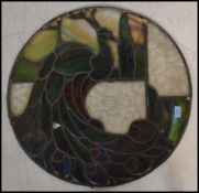 A fantastic 19th century stained glass window depicting a peacock. Coloured glass leaded panels with