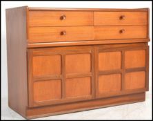 A retro 20th Century teak wood Nathan sideboard / credenza having four drawers to the top with
