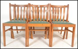 A set of six vintage A / C stamped rail back dining chairs dated 1962, with drop in seat pads raised