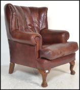 A good contemporary antique style Chesterfield armchair upholstered in a good brown leather.