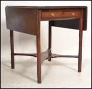 A 19th century George III drop leaf square sofa table  desk. Raised on unusual turned legs with