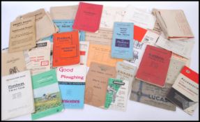 A collection of vintage early 20th century agricultural and industrial machine handbooks and manuals