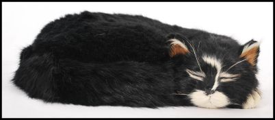 An 'Able Seaman Simon Hero of HMS Amethyst' replica cat made from rabbit fur, having a description