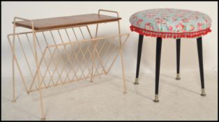 A retro / vintage mid 20th Century foot stool raised on four tapering legs with a circular stool