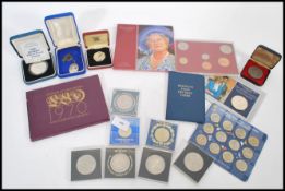 A collection of Proof and commemorative coins including a Queen Mother silver proof Crown, Centenary