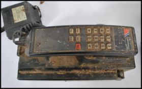 A vintage late 20th century large mobile phone with large brick battery and handset by Motorola