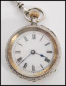 A continental silver 935 ladies pocket fob watch set to a decorative silver albert chain. The
