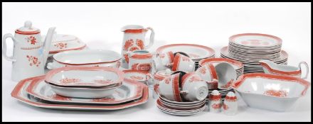 An extensive dinner service by Spode in the Fitzhugh Red pattern, to include meat platters,