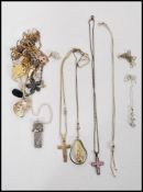 A collection of silver and non silver necklaces and pendants to include crucifix cross on rope twist