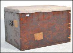 A 19th century Victorian pine blanket box with panelled sides having hinged top with upholstered