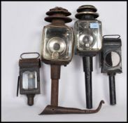 A group of vintage lights to include a pair of antique carriage lamps with glazed panels along