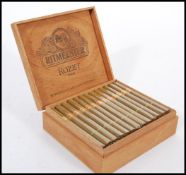 A box of 50 Ritmeester Rozet Mild Dutch Panatella cigars all appearing sealed and in fitted cedar