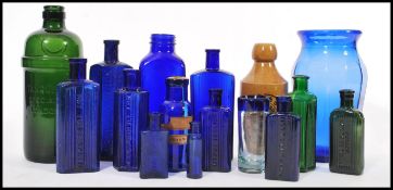 A collection of 19th Century Victorian apothecary / shop bottles to include a green glass