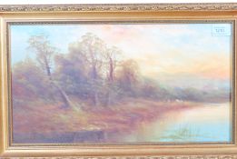 A 19th Century oil on board painting depicting sheep at waters edge with woodland and mountains to