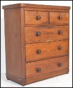 A Victorian mahogany chest of drawers having bun feet with 2 short over 3 deep drawers having knob