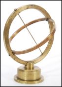 An unusual vintage early 20th century bronze nautical ships instrument raised on circular base