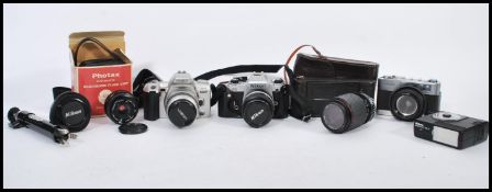 A good collection of vintage cameras, lenses and photographic equipment to include Nikon, Nikon