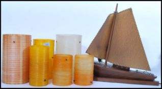 A collection of retro 20th Century fiberglass spun lamp shades of cylindrical form together with a