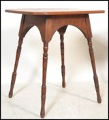 A 19th Century mahogany Victorian Arts and Craft aesthetic movement side table raised on four