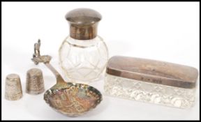 Two silver lidded vanity table / dresser items to include a cut glass rectangular box having a