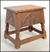 A Jacobean 17th century revival coffin stool box. Raised on block and turned legs with peripheral