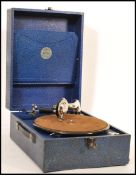 A vintage 20th century blue cased portable record player gramophone by Antonia having hinged lid