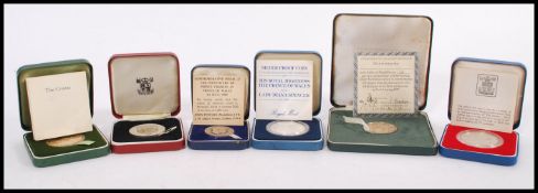 A collection of six cased silver proof coins / medals to include a 1981 silver proof coin for