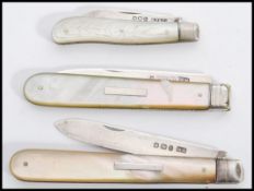 A group of three silver hallmarked and mother of pearl handled fruit pen knives. One hallmarked