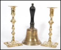 A vintage early 20th Century bronze school bell, turned wooden handle together with a pair of 19th