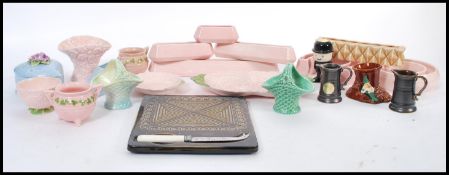 A collection of vintage retro ceramics to include a selection of SylvaC planters in rose pink and